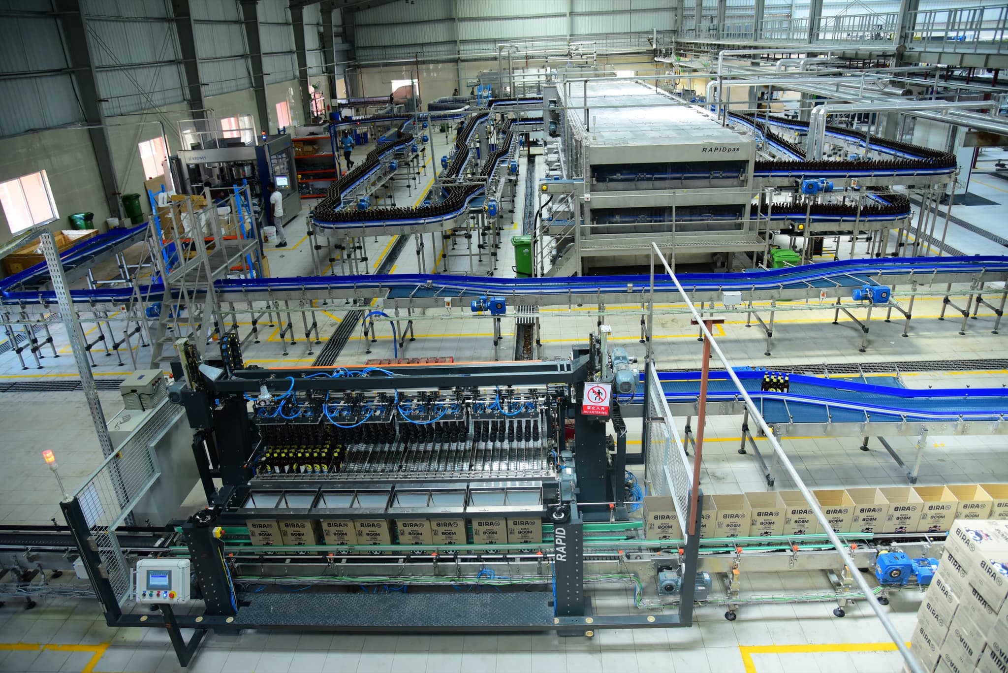 Glass bottles flowing through the line